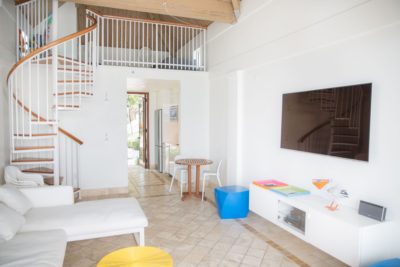 The Tropical Cabana Living Room and Stairs